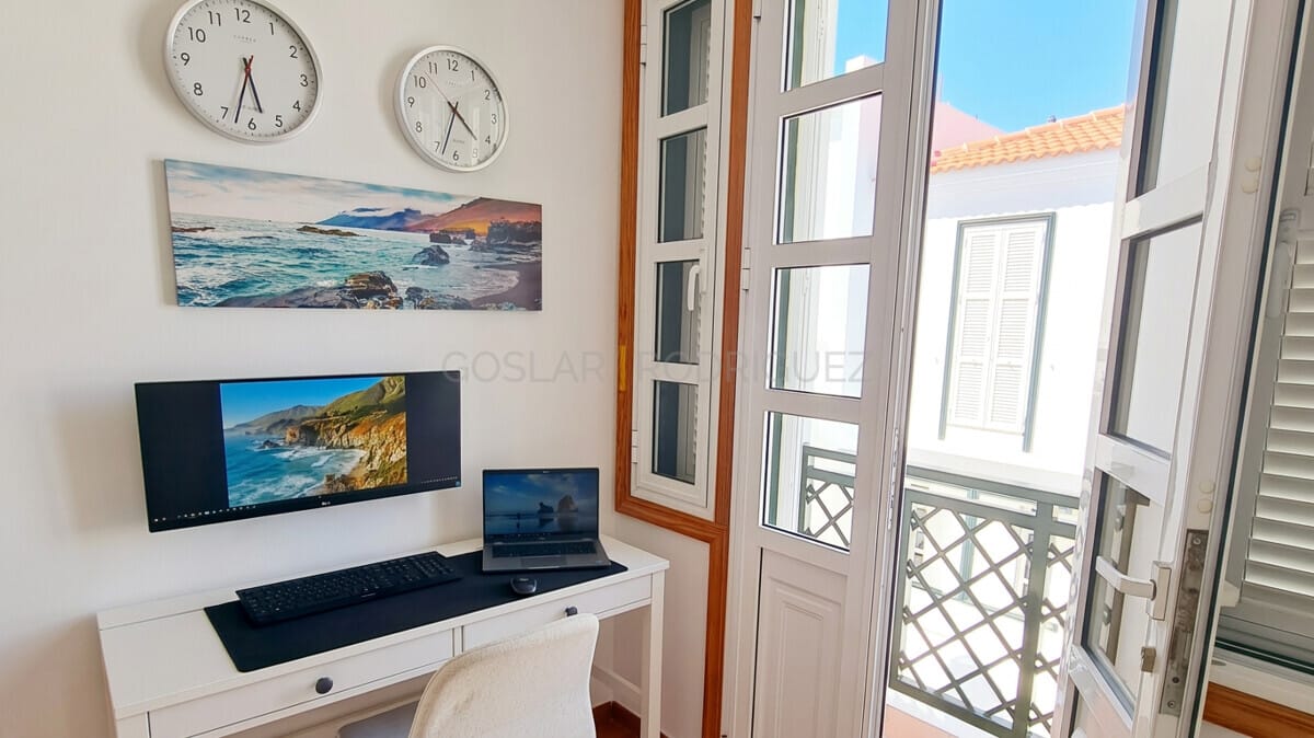 Home office with desk, computer, and balcony access in a villa in Abades, Tenerife.