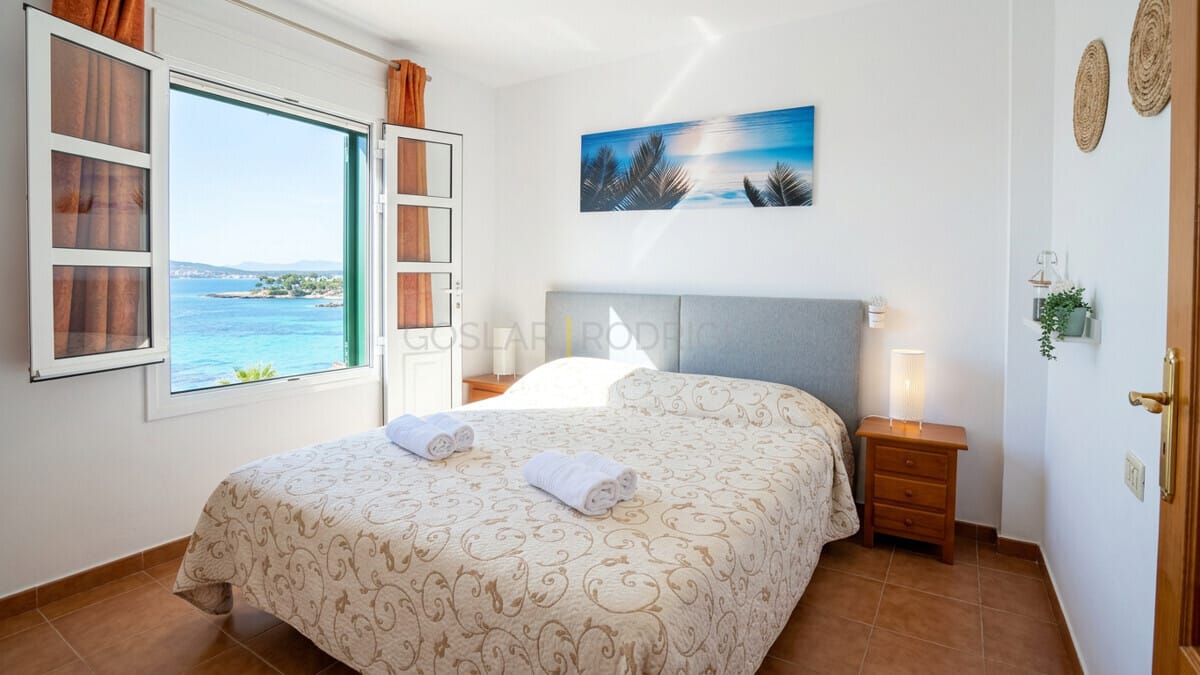 Bedroom with sea view through open window in Abades, Tenerife.