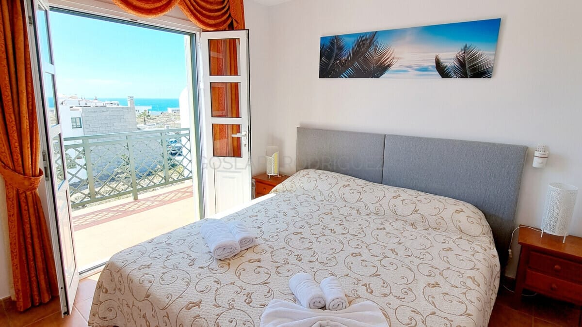 Master bedroom with balcony access and sea views in Tenerife.